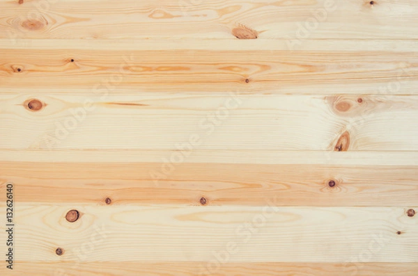 Fototapeta Fresh knotted pine wood planks background top view. Visible texture with natural patterns.