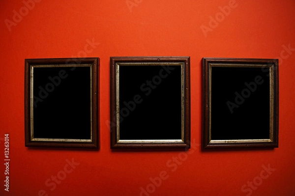 Obraz empty picture frames on red wall