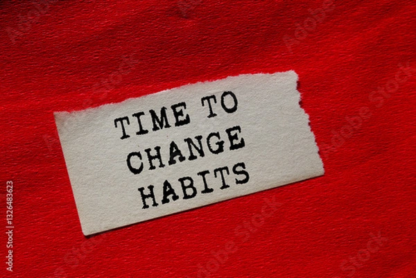 Fototapeta Time to change habits message written on ripped torn paper piece on red background. Conceptual time to change habits symbol. Copy space.