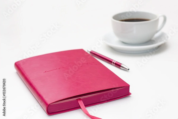 Obraz pink diary with pen and a Cup of black coffee on white. business minimal concept for women.