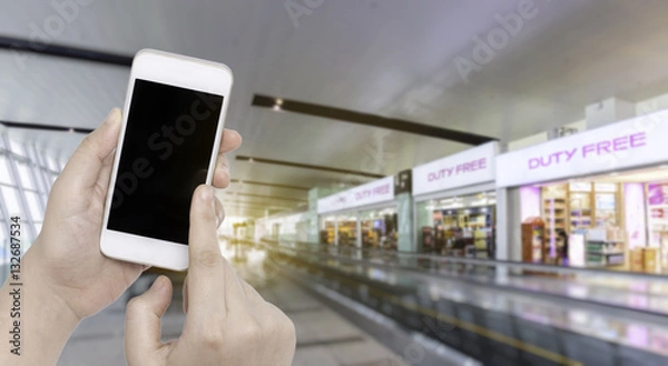 Obraz female hand holding a credit card  with Blur Background of duty