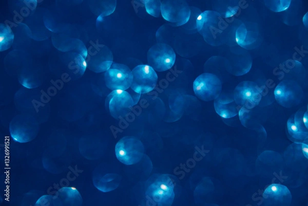 Obraz A blue bokeh-style background with defocused light creates an elegant space for text or design elements.