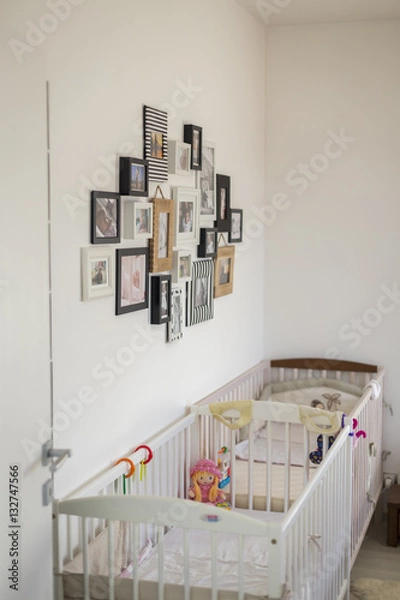Fototapeta bedroom with photos in various photo frame