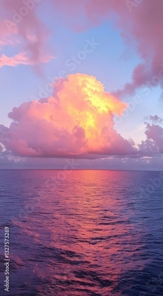 Fototapeta beautiful sunset with pink and purple clouds on the sea, ideal for an mobile phone wallpaper, phone background, or screen