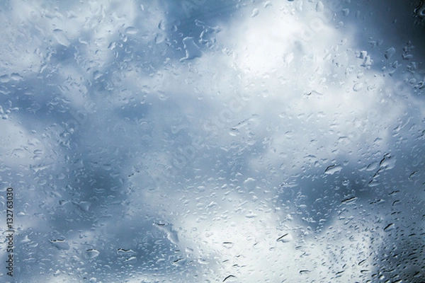 Obraz Wet window with background of dark cloudy sky.