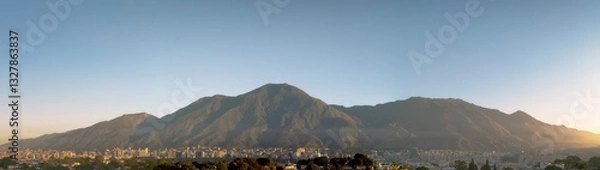 Obraz sunrise panoramic view of Caracas and the iconic mountain named Avila, Showing a wide view of Caracas City