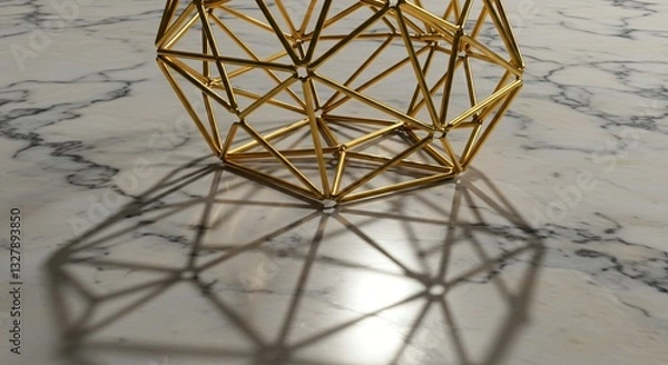 Fototapeta Geometric gold wireframe sculpture casting intricate shadows on a marble surface