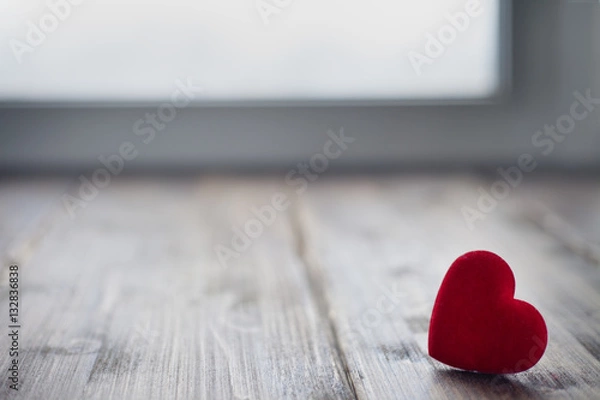 Fototapeta Red heart made of fabric on vintage background toned