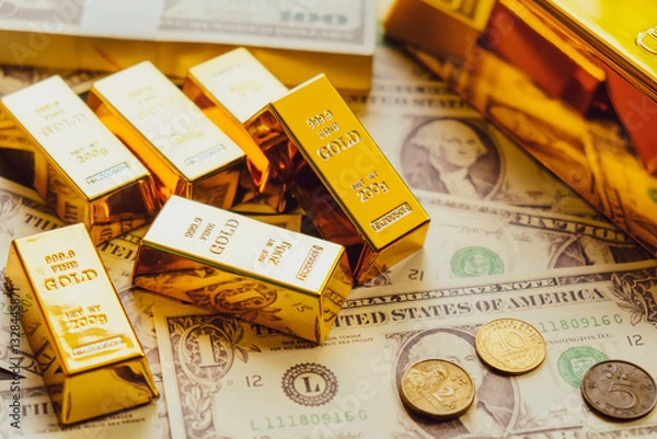Obraz Gold bars on the background of dollar bills. The concept of wealth
