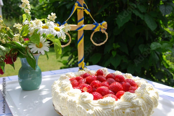 Obraz Cake with strawberries and cream at a table