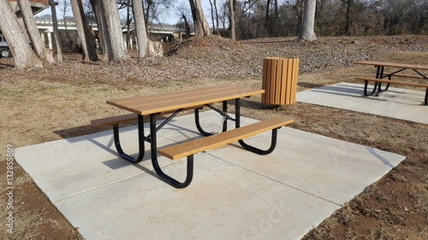 Fototapeta Picnic table and trash can