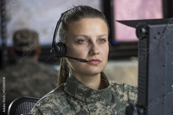 Fototapeta Female drone operator working at computer