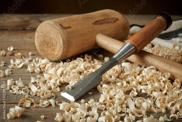 Fototapeta woodworking tolls, chisels and mallet on workbench