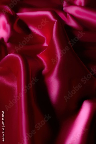 Fototapeta Luxurious silky fabric in deep magenta with elegant folds and soft lighting. Perfect for fashion design, textile backgrounds, branding, digital art, beauty aesthetics, romantic themes