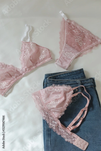 Fototapeta Woman's silk erotic lingerie on the white bed sheets. Valentine's day concept. Lace sexy female underwear. Beauty, fashion blogger concept. Female bra, panties, erotic clothes. Lingerie advertising