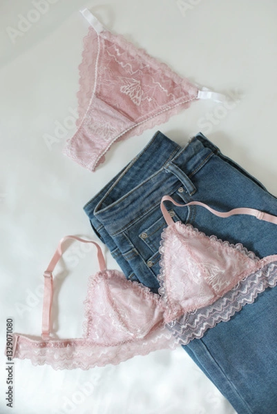 Fototapeta Woman's silk erotic lingerie on the white bed sheets. Valentine's day concept. Lace sexy female underwear. Beauty, fashion blogger concept. Female bra, panties, erotic clothes. Lingerie advertising