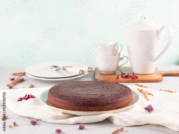 Fototapeta Vegan beetroot chocolate cake with tea table setting