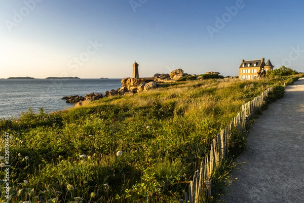 Obraz The Ploumanach Lighthouse officially the Mean Ruz Lighthouse and the customs path located on a cape of pink granite rock located in Perros-Guirec, Bretagne, France