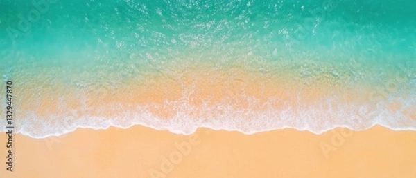 Fototapeta Aerial View of Turquoise Ocean Waves Gently Crashing on a Sandy Beach