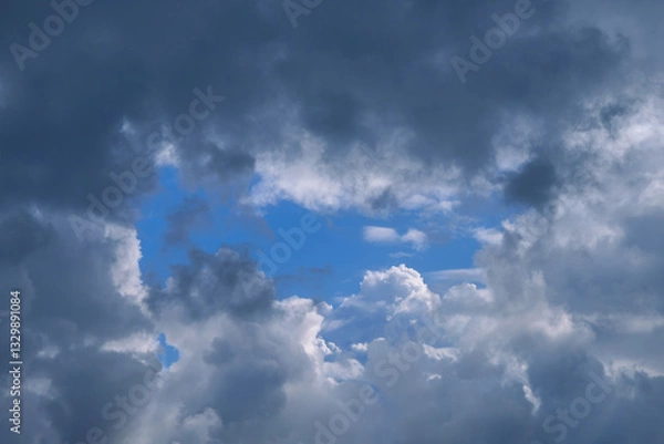 Fototapeta Summer evening sky in the picturesque clouds, lit by the rays of the setting sun.