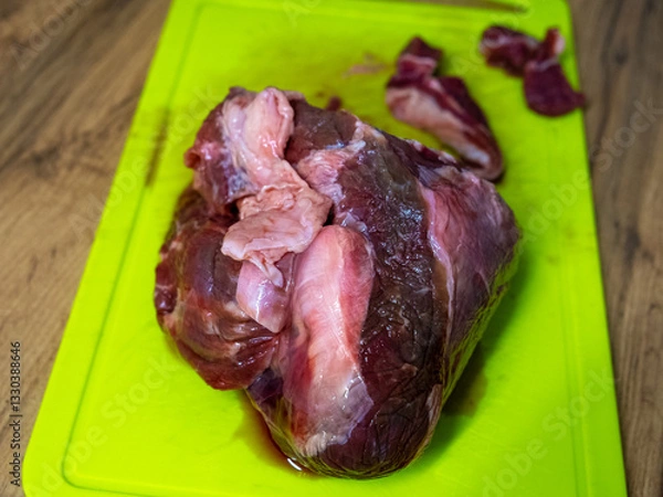 Fototapeta Fresh, Raw Meat on a Cutting Board, Perfectly Positioned and Ready for Preparation and Cooking