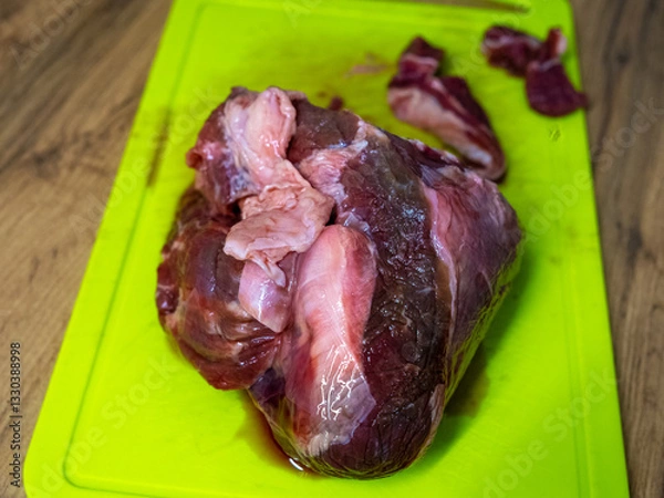 Fototapeta Raw Meat Laid Out on a Cutting Board for Culinary Preparation and Food Preparation