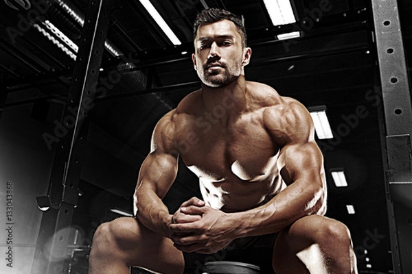 Obraz Bodybuilder posing in the gym