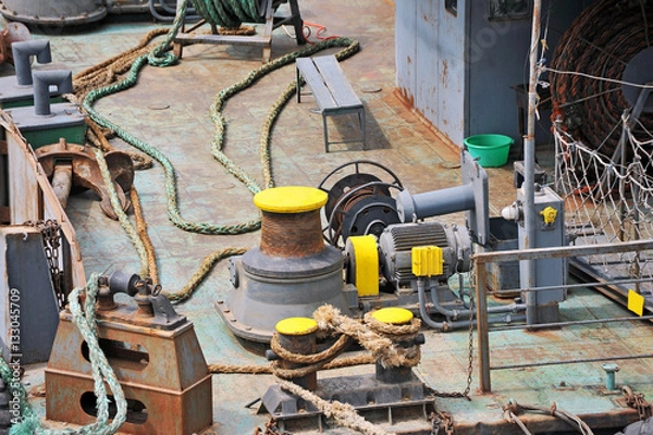 Fototapeta Anchor winch mechanism with chain in ship