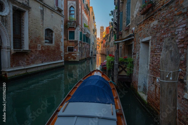 Obraz Gondola Navigating a Narrow Canal in Venice, Italy
