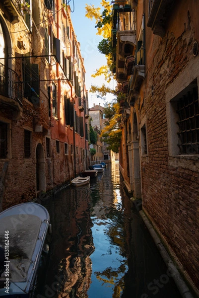 Obraz Sunlit Canal with Historic Buildings in Venice, Italy
