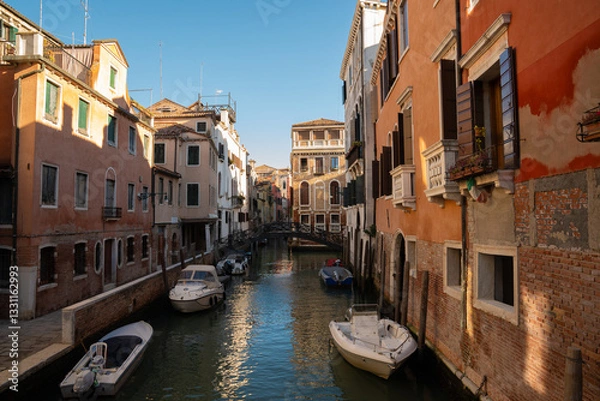 Obraz Sunlit Canal with Historic Buildings in Venice, Italy
