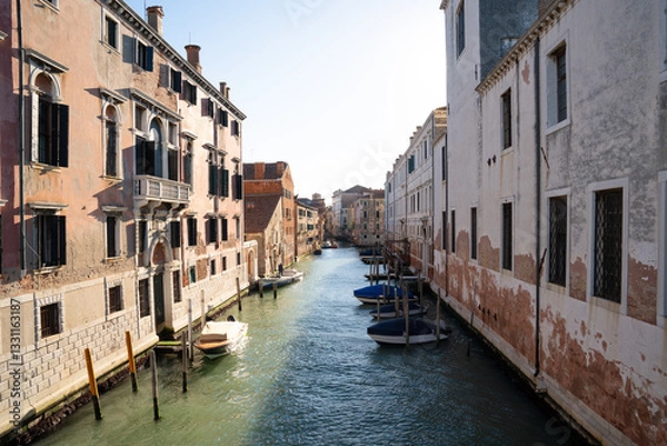 Obraz Sunlit Canal with Historic Buildings in Venice, Italy
