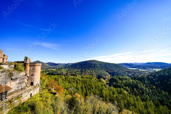 Fototapeta View of the Altdahn castle massif and the surrounding landscape with green forests. Nature at the medieval rock castle in the Palatinate region.
