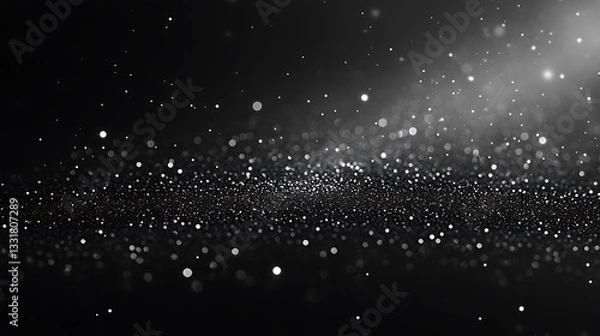 Fototapeta Abstract black and white background with shimmering particles and bokeh effect, resembling a starry night sky or cosmic scene
