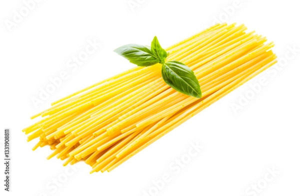 Fototapeta Uncooked yellow spaghetti with fresh basil on black background, cut out