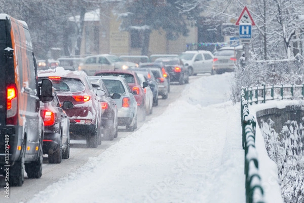 Fototapeta Traffic jam in the middle of winter. Snow calamity.