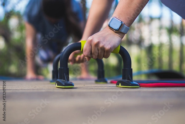 Fototapeta close-up of girl doing push-ups with smart watch
