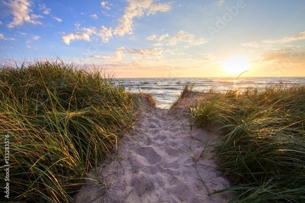 Obraz Path To A Summer Sunset Beach. Sandy beach trail leads to a sunny summer horizon over the open waters of Lake Michigan. Hoffmaster State Park. Muskegon, Michigan.