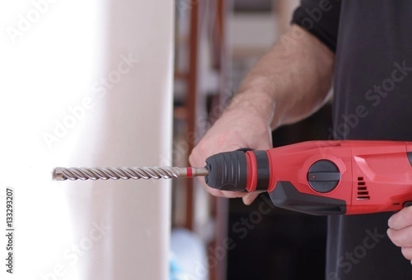 Obraz Mann beim Bohren