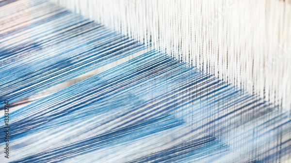Obraz Closeup, abstract motion blur of silk fabric weaving