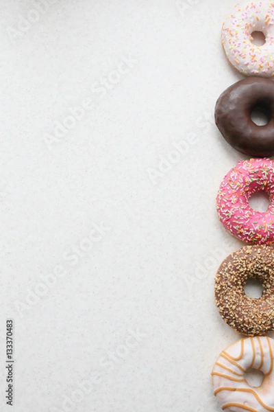 Obraz colored donuts on a light background