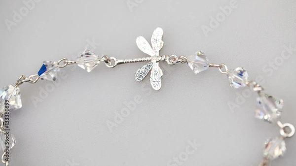 Obraz Silver jewels with colorful precious stones and light grey background