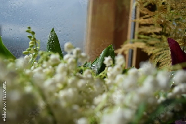 Fototapeta Spring Bouquet of Lilies of the Valley and Pink Flowers by the Window
