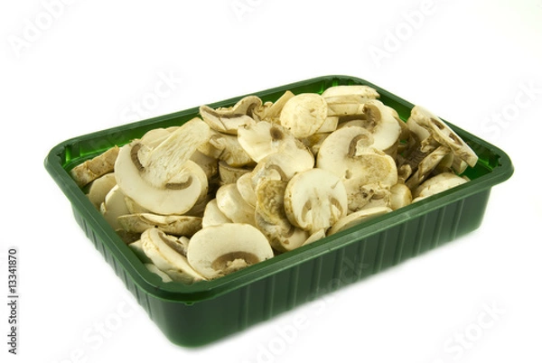 Obraz Sliced champignon mushrooms in green pack