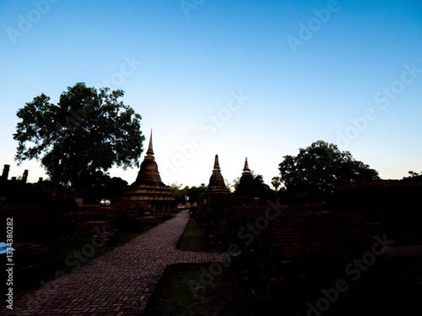 Fototapeta Three Chedis of Sukhothai: Traces of Civilization on an Ancient Path
