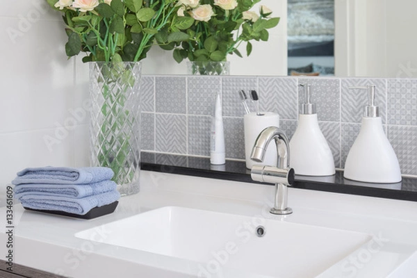 Fototapeta washbasin with faucet and liquid soap bottle at home