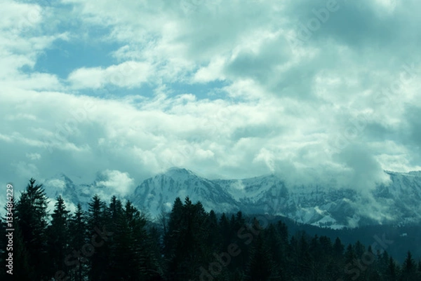 Obraz Wolken über einer Berglandschaft