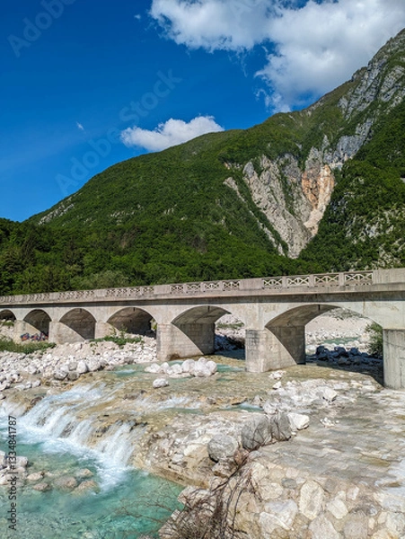Obraz Soca Valley, Slovenia – Aerial view of the emerald-green Alpine River Soca on a bright sunny summer day with green foliage..The last wild river in Europe in Triglav National Park near the Vricic Pass