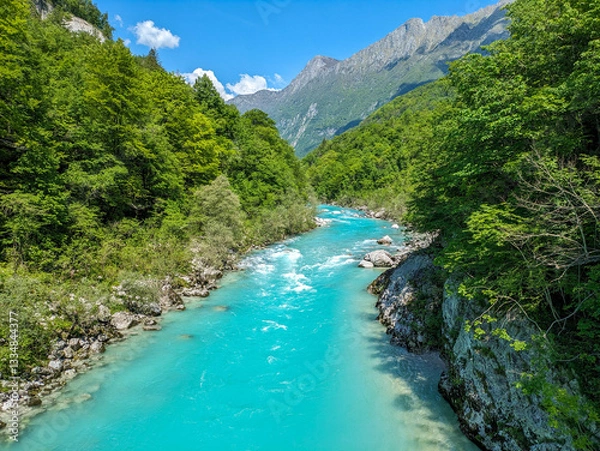 Obraz Soca Valley, Slovenia – Aerial view of the emerald-green Alpine River Soca on a bright sunny summer day with green foliage..The last wild river in Europe in Triglav National Park near the Vricic Pass