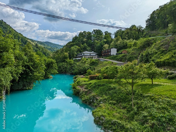 Obraz Soca Valley, Slovenia – Aerial view of the emerald-green Alpine River Soca on a bright sunny summer day with green foliage..The last wild river in Europe in Triglav National Park near the Vricic Pass